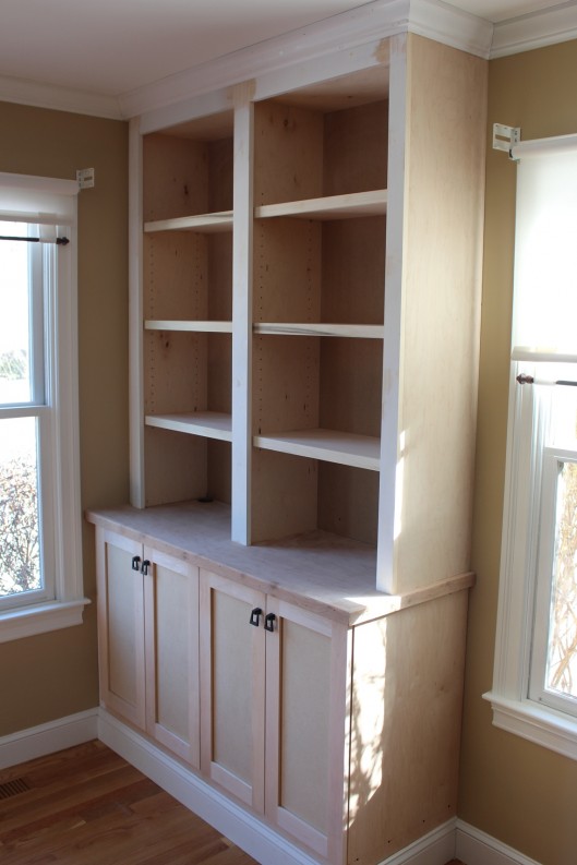 Image of built in bookcase with doors